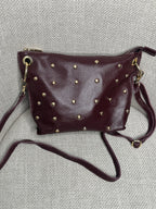 Bolso tachas